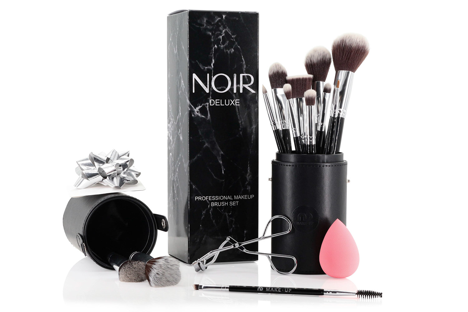 Makeup Brush Set from Noir including a selection of brushes and eyelash curlers